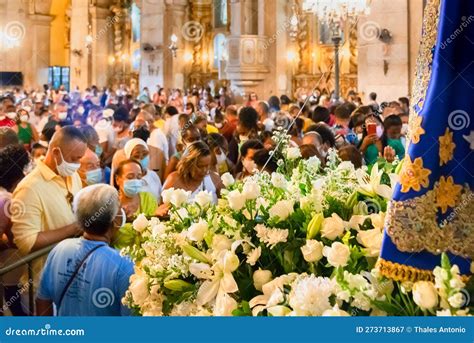 catholic faithful attend a mass in honor of nossa senhora da conceicao da praia editorial