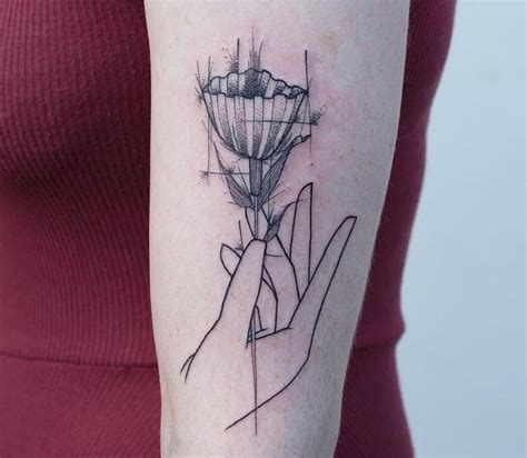 Hand Holding Flower Tattoo By Gio Luca Tattoonow