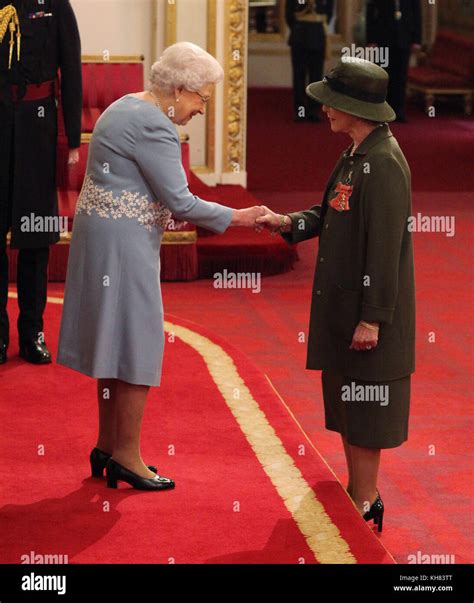 Is Made An Obe By The Queen At Buckingham Palace Hi Res Stock