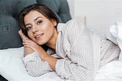 Beautiful Girl In Pajamas Relaxing In Bed Stock Photo Dissolve