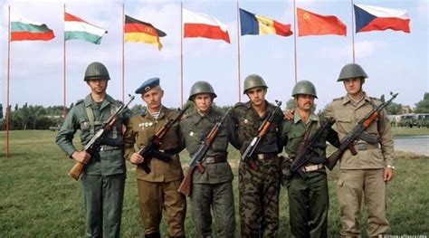 soldiers of the eastern bloc take a photograph together while doing a joint military exercise