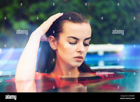 Portrait Of A Beautiful Woman In The Swimming Pool Stock Photo Alamy