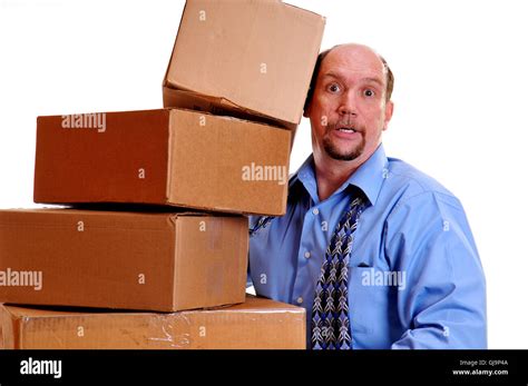 Man Carrying Heavy Boxes Stock Photo Alamy