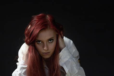 Portrait Of Beautiful Redhead Young Woman In Trouble Looking At