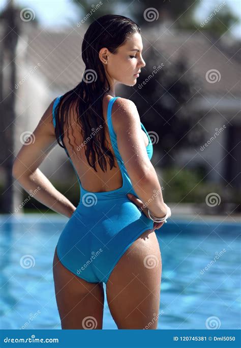 Beautiful Tanned Woman In Blue Swimwear Relaxing In Swimming Pool Spa