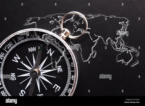 world map and compass showing business guidance concept Stock Photo - Alamy