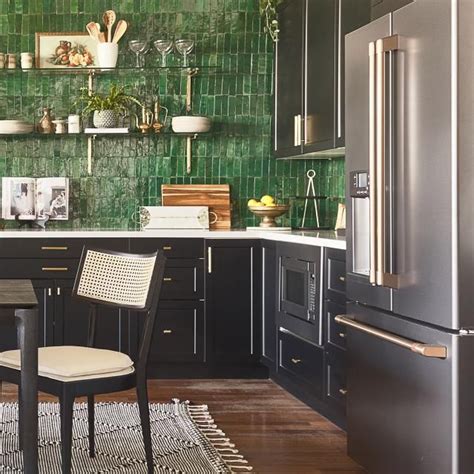 Bold Green Tile Wall Accents A Kitchen With Matte Black Appliances