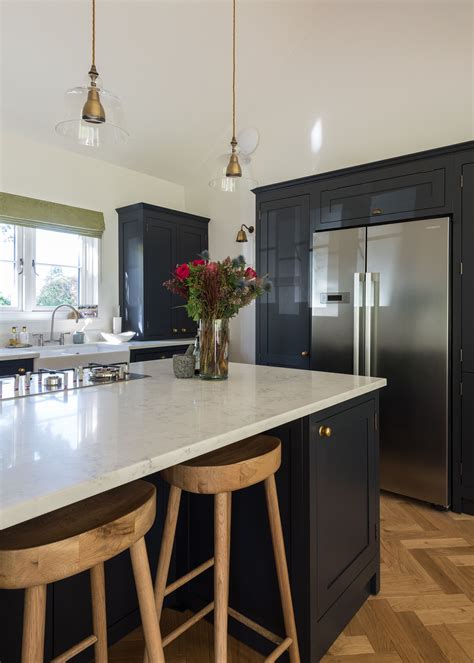 Grey is a true neutral that can look at home in modern kitchens just as well as traditional spaces, much like the versatile design of shaker cabinets themselves. An American fridge freezer in a grey Shaker kitchen ...
