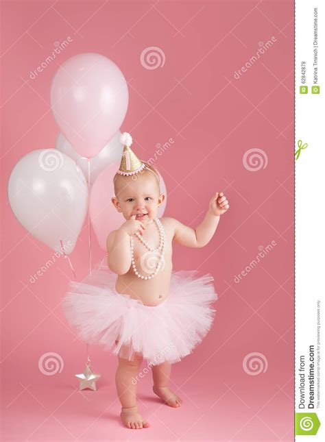 Smiling One Year Old Birthday Girl Wearing A Pink Tutu Stock Image