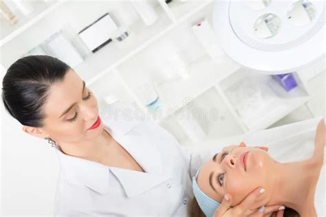 Female Beautician Doctor With Patient In Wellness Center Professional Cosmetologist Make