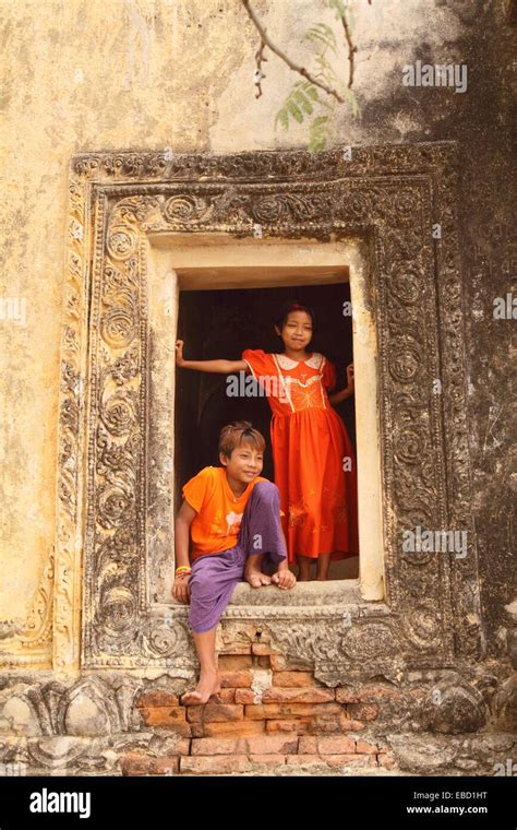Young Boy And Girl Playing Near Temple In Bagan Myanmar Burma Stock