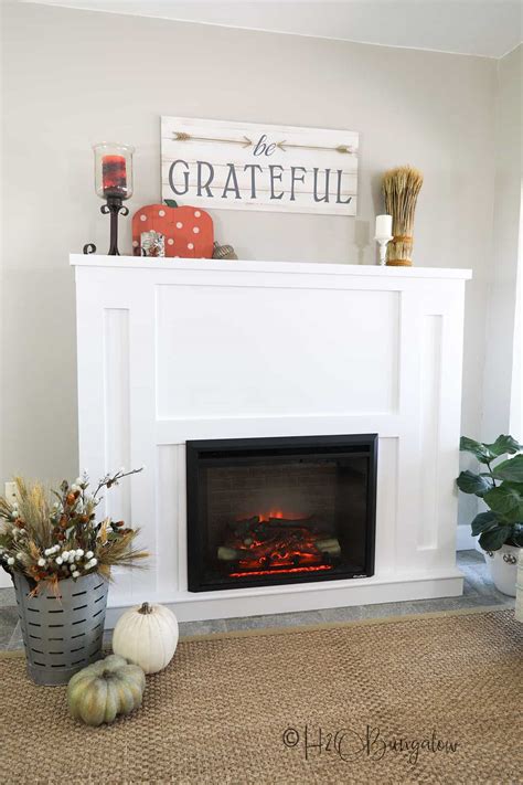 Then, we tiled the fireplace surround up to the edge of the firebox and hearth on the floor. 15 DIY Fireplace Surrounds (Awesome Ideas)