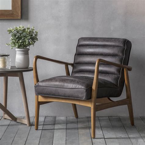 High back armchairs with wooden arms. Black Leather Armchair By Primrose & Plum ...