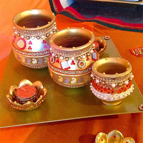 Maybe you would like to learn more about one of these? A traditional indian gift plate with decorated pots ...