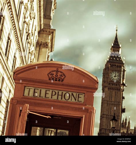 A View Of A Classic Red Telephone Booth And The Big Ben In The