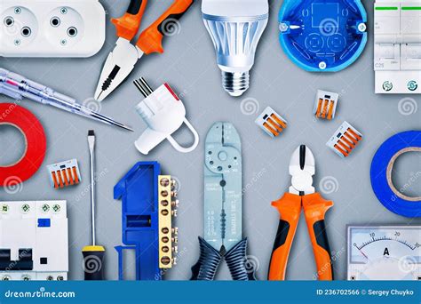 Different Electrical Tools And Equipment On Grey Background T Stock