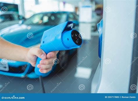 Man Charge His Electric Car At City Charging Station Stock Image