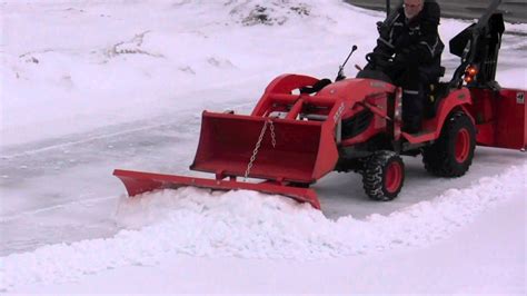 Snow Blower Plow And Bucket On Kubota Bx Clearing Hard Snow Youtube