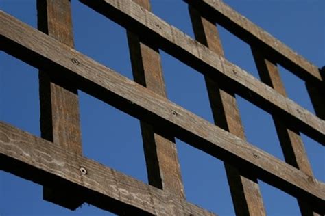 Each kit contains 4 mounting brackets, screws and plastic anchors to attach 1 trellis. How to Attach a Trellis | HomeSteady