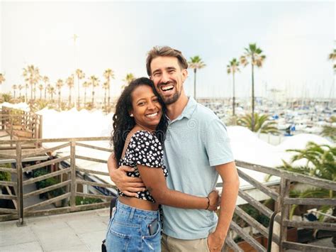 Happy Diverse Smiling Heterosexual Young Couple Looking At Camera