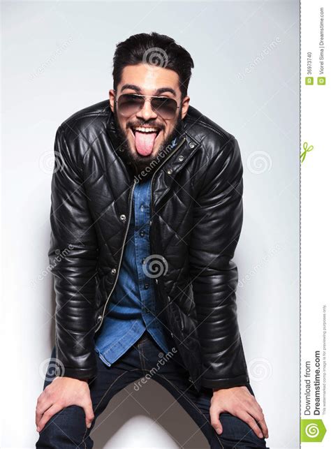 Happy Fashion Man Sticking Out His Tongue Stock Photo
