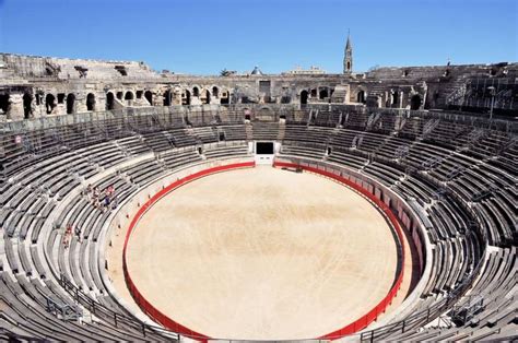 The Roman Amphitheater In Nîmes Is Together With The Theater In Arles