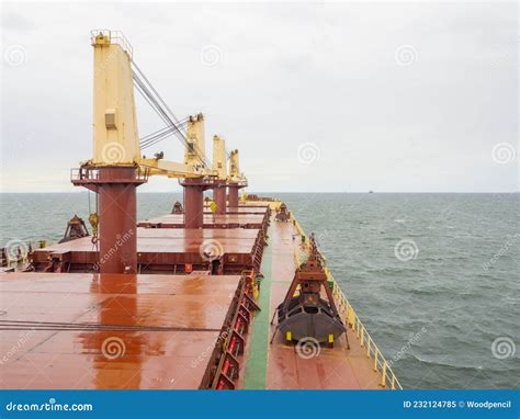 Dry Bulk Carrier Ship With Crane Crab And Towers At Sea Deck View
