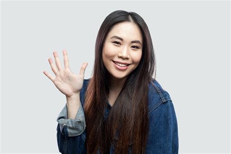 Portrait Of Happy Beautiful Brunette Asian Young Woman In Blue Denim Jacket Makeup Standing And