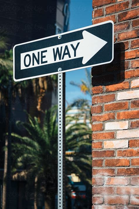 One Way Sign Besides A Brick Wall By Stocksy Contributor Victor