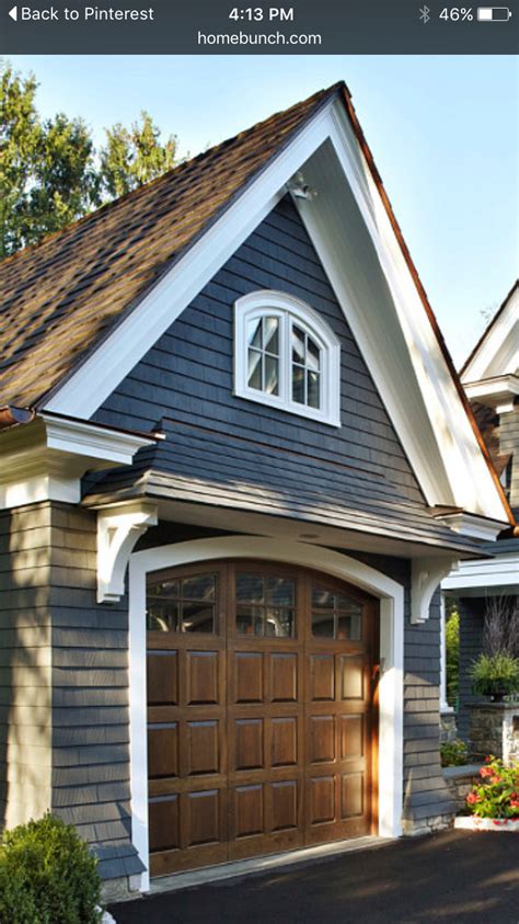 Dark stained wood also looks great with a white exterior. Pin by Louann Larson on exterior | Garage design, House ...