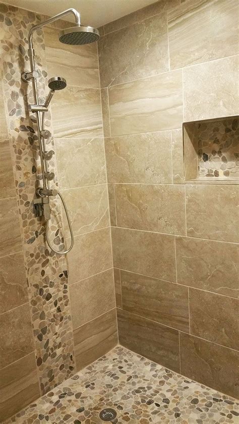 In this case, a small bathroom with one large window is paved with neutral marble tiles, giving it a pleasant antique feel. Pebble Stone Sliced Mixed Tile | Bathroom remodel shower ...