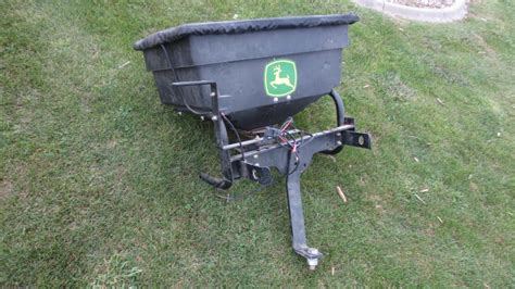 John Deere Electric Broadcast Spreader For Mower Mounts On Rear Of Jd