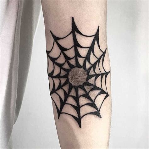 A Blackwork Spider Web Tattoo Inked On The Right Elbow Spider Web