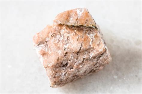 Unpolished Granite Pegmatite Rock On White Marble Stock Photo Image