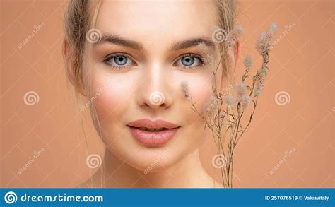Portrait Of Young Beautiful Woman With A Healthy Skin Of Face