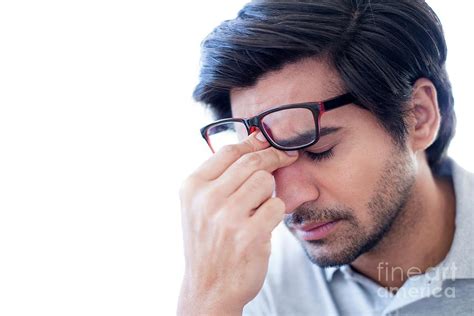 Man Pinching The Bridge Of His Nose Photograph By Science Photo Library