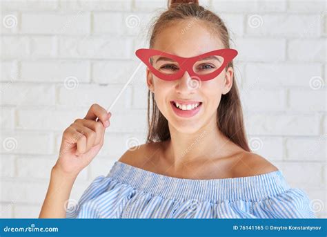 Close Up Of Pretty Girl With Nude Make Up Wearing Paper Glasses Stock