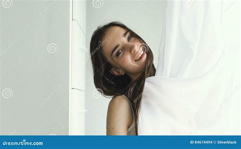 Slowmotion Beautiful Girl Pose Into Camera And Smililng Near Window
