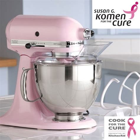 A Pink Mixer Sitting On Top Of A Counter