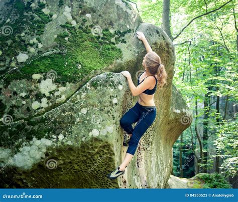 Young Woman Climbing On Large Boulders Outdoor Stock Image Image Of