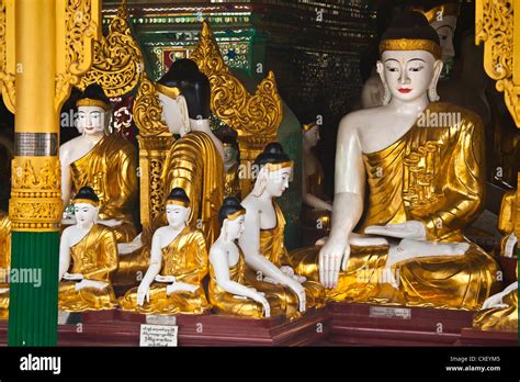 Buddha Statues Are Worshipped At The Shwedagon Paya Or Pagoda Which