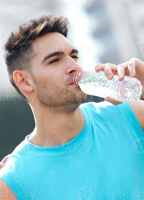 Young Athlete Drinking Water After Exercise 884249 Stock Photo At Vecteezy