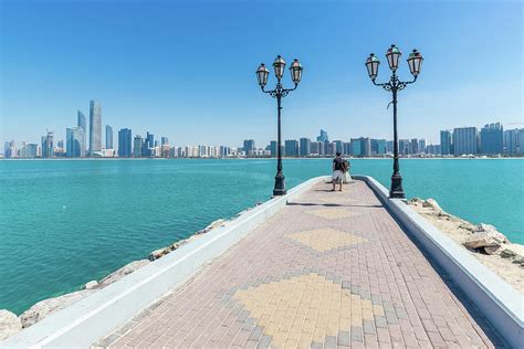 Tourist On Breakwater Beach In Abu Dhabi Uae Photograph By Manuel