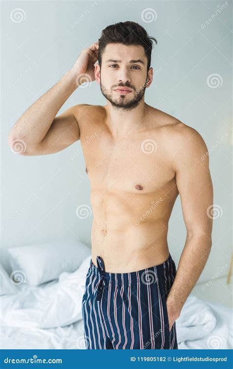 Handsome Shirtless Man Standing In Bedroom Stock Photo Image Of