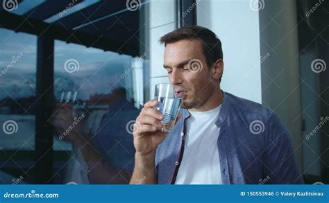 Relaxed Man Drinking Water Near Window Thirsty Male Person Drinking Water Stock Footage