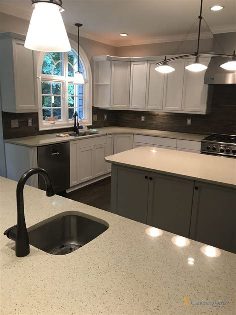 You can see in this photo (below) that the casings around the door in fact still look slightly whiter than the lacquered cabinets which will often end up creamier. Extra White with Pewter Glaze - 2 Cabinet Girls