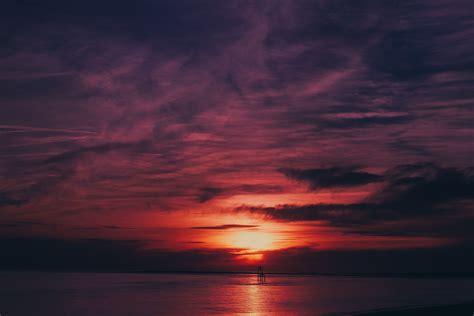 Sky Sea Flares Sunset Water Reflection 4k Wallpaperhd Nature