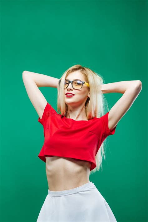 Blonde Girl With Long Hair And Eyeglasses Wearing White Skirt And Short