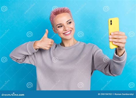 Photo Of Lovely Cheerful Girl Beaming Smile Make Selfie Arm Finger Show Thumb Up Isolated On