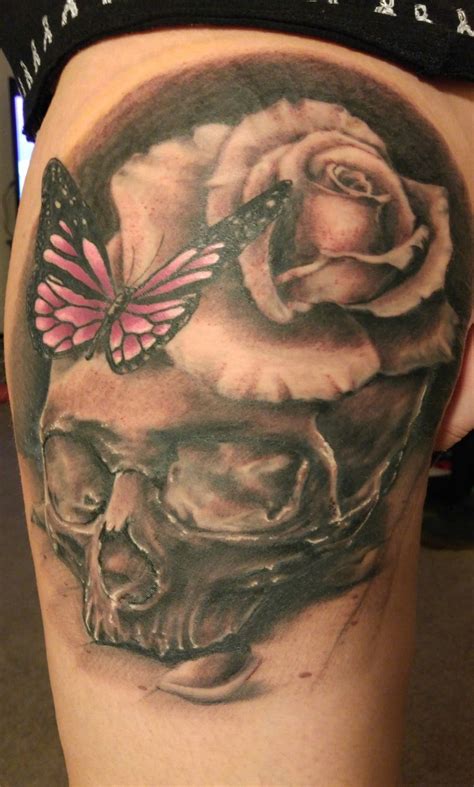 Skull tattoos & rose tattoos. Skull rose butterfly thigh tattoo. Color infused black and ...